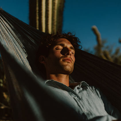 Man sleeping in hammock in the Mesa desert