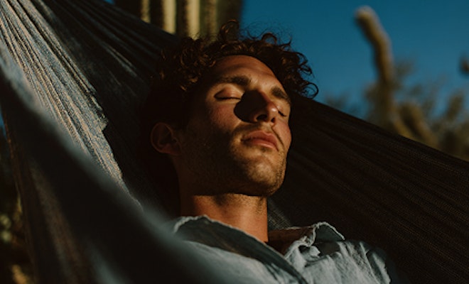 Man sleeping in hammock in the Mesa desert