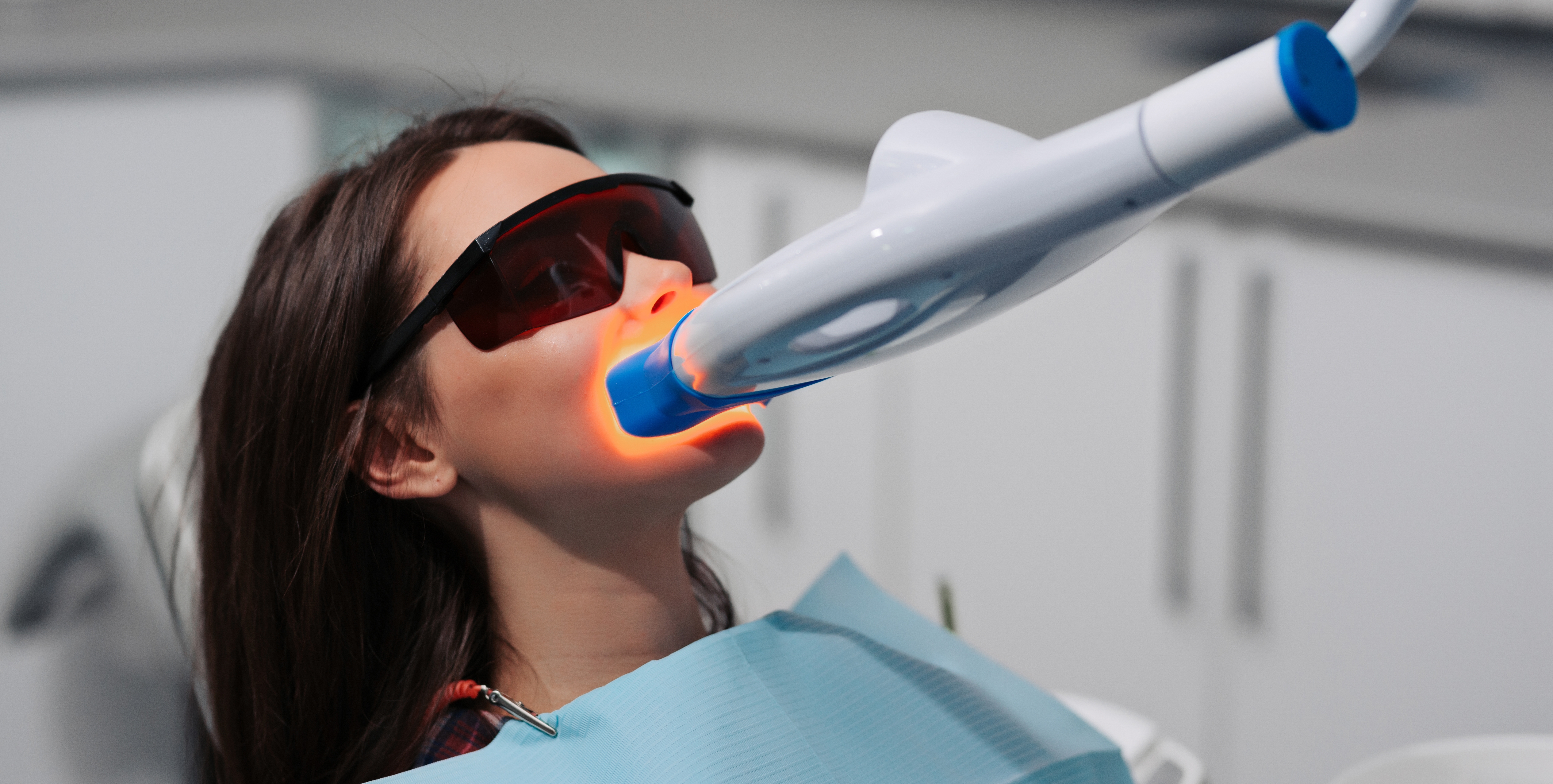 Woman getting her teeth professionally whitened