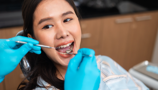 girl getting a dental exam