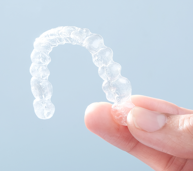 hand holding Invisalign