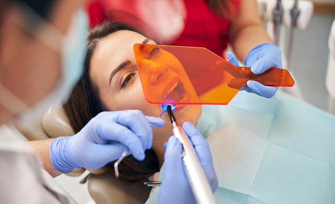 woman undergoing a dental bonding procedure