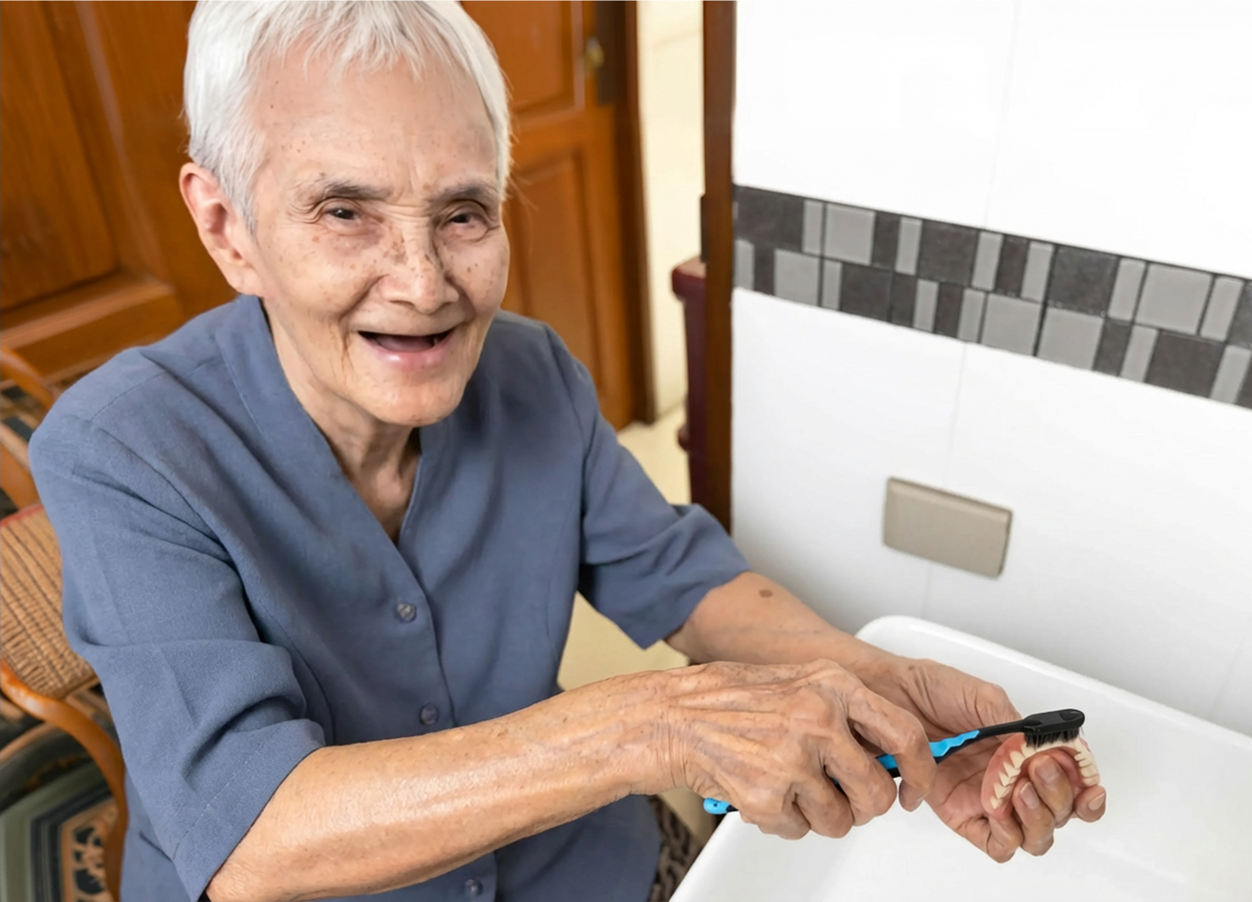 Man cleaning dentures