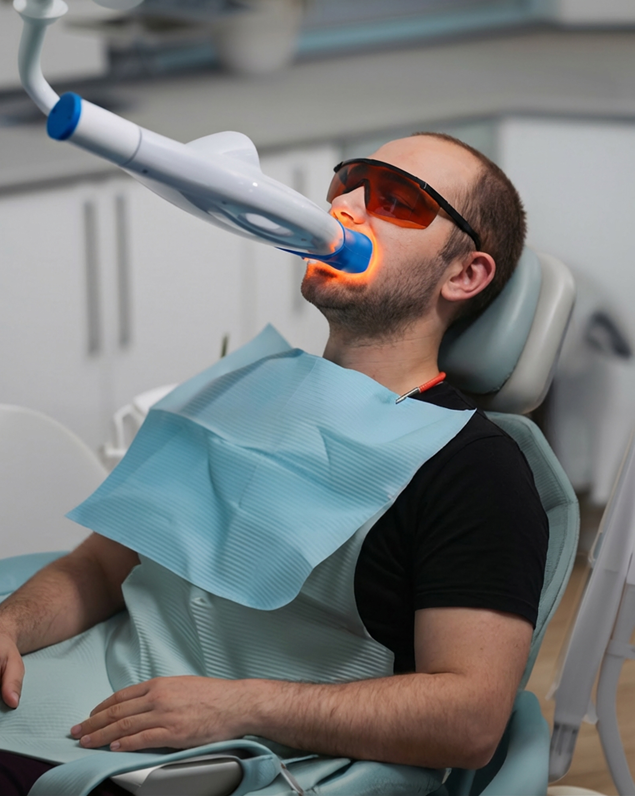 Man getting his teeth professionally whitened
