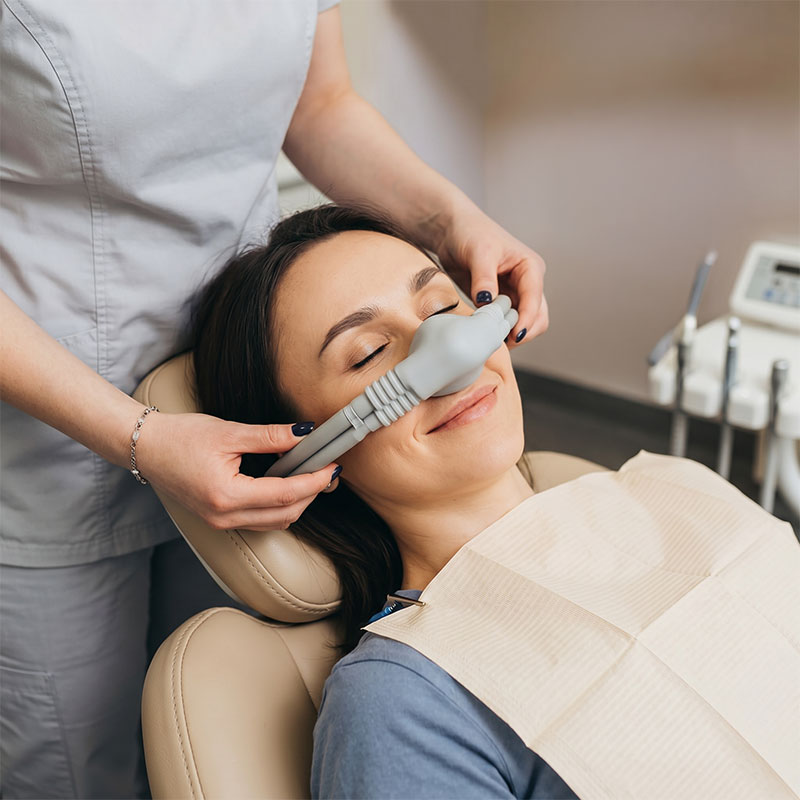 Woman undergoing nitrous oxide sedation