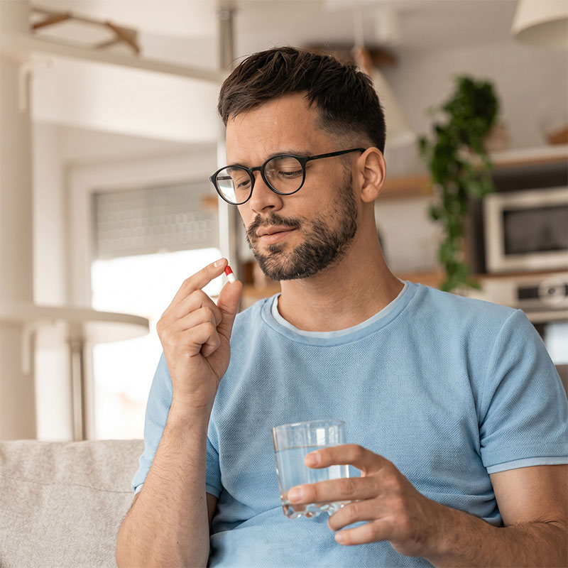 Man taking prescription pill