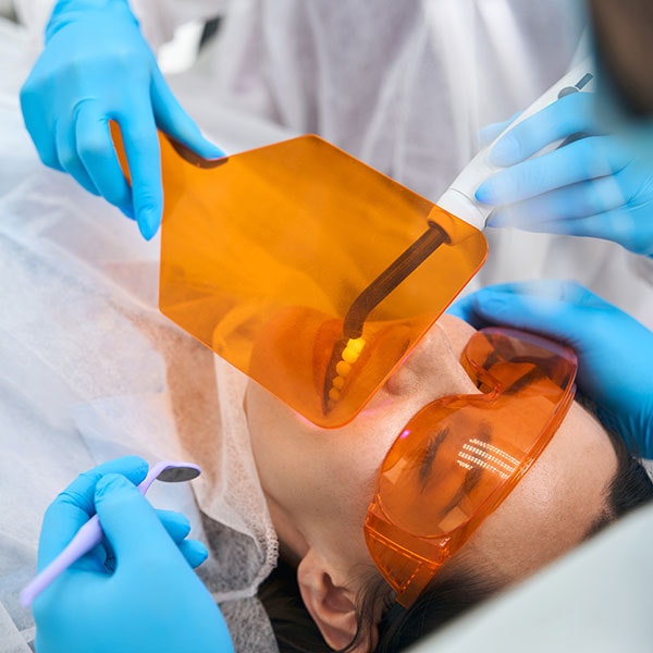 Woman undergoing dental bonding