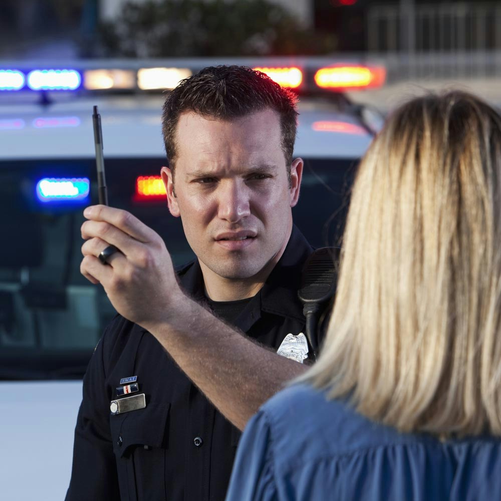 Cop giving woman sobriety test