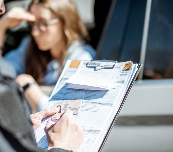 Officer filling out paperwork on DUI driver
