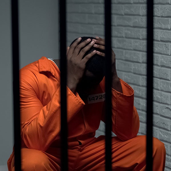 Sad man in jail