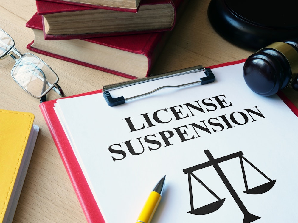 License suspension document and gavel