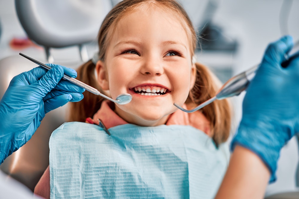 Smiling child in dentist chair