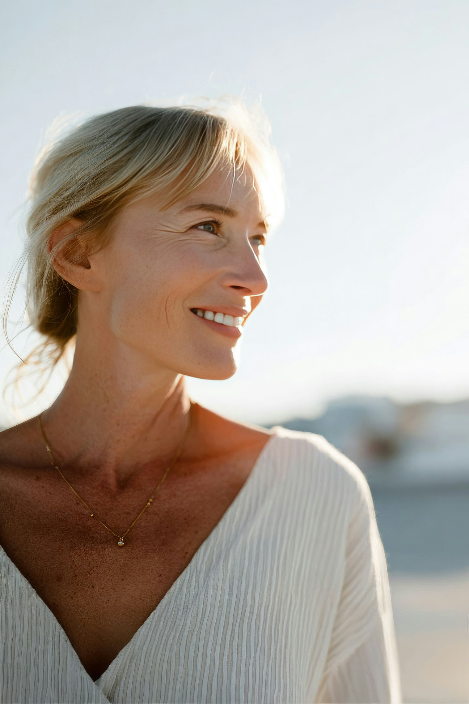 Smiling woman after full mouth reconstruction