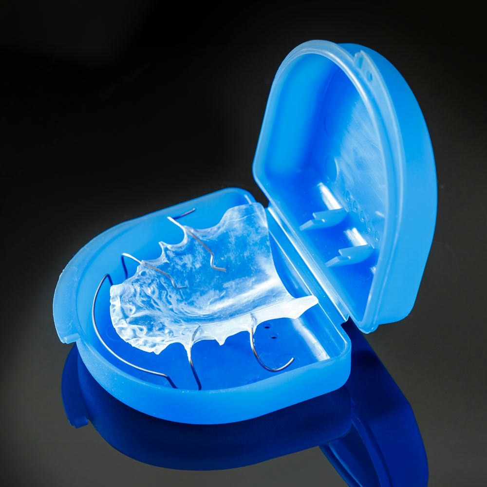 retainer in a blue container