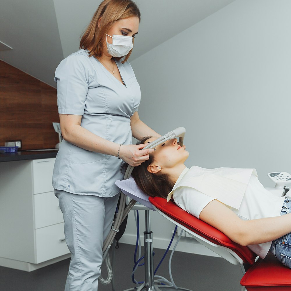 female patient undergoing dental sedation