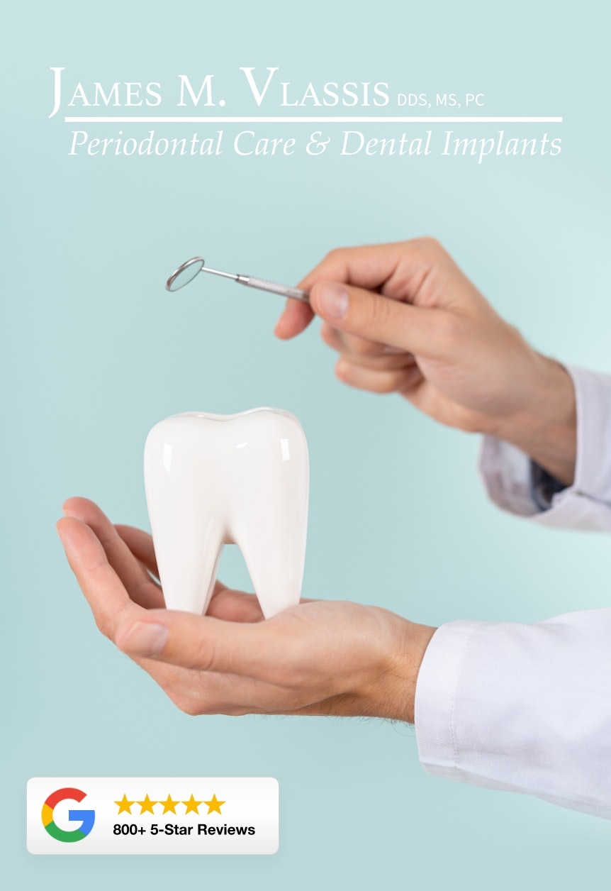 model tooth and dentist's hands