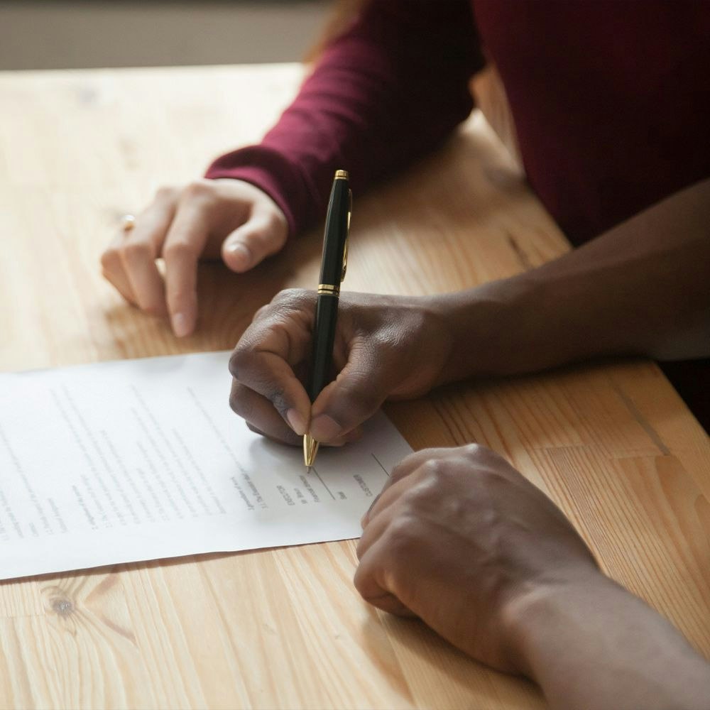 Couple signing a prenup
