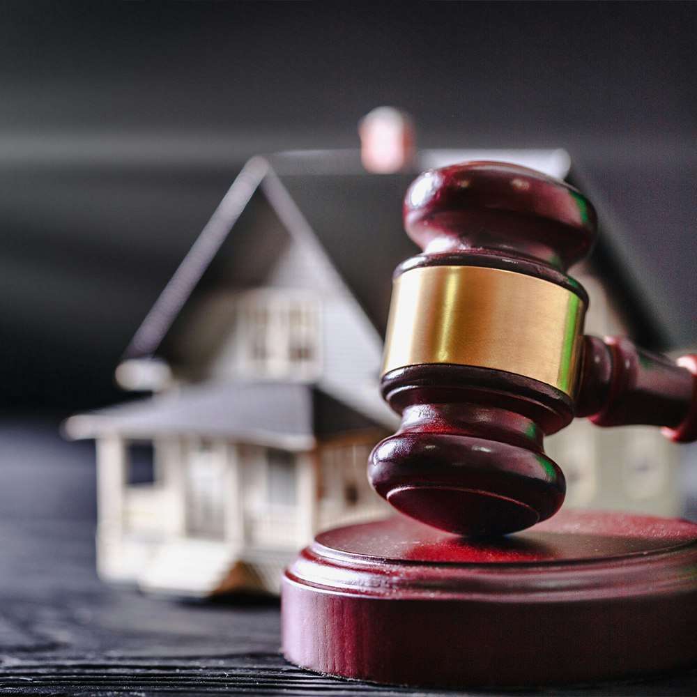 Close up of a gavel with wedding bands