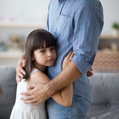 Little girl hugging her father
