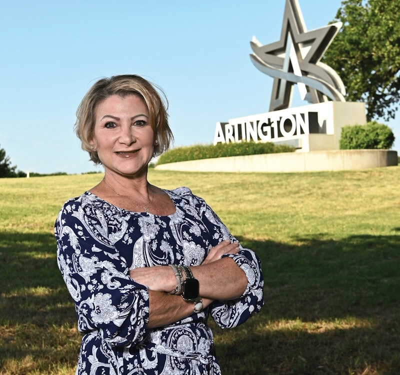 Donna J. Smiedt in front of Arlington sculpture