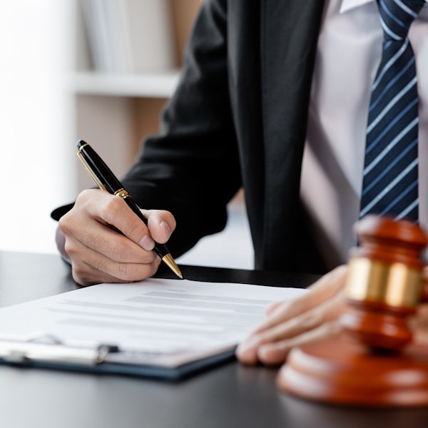 Finalization paperwork for an adoption next to gavel
