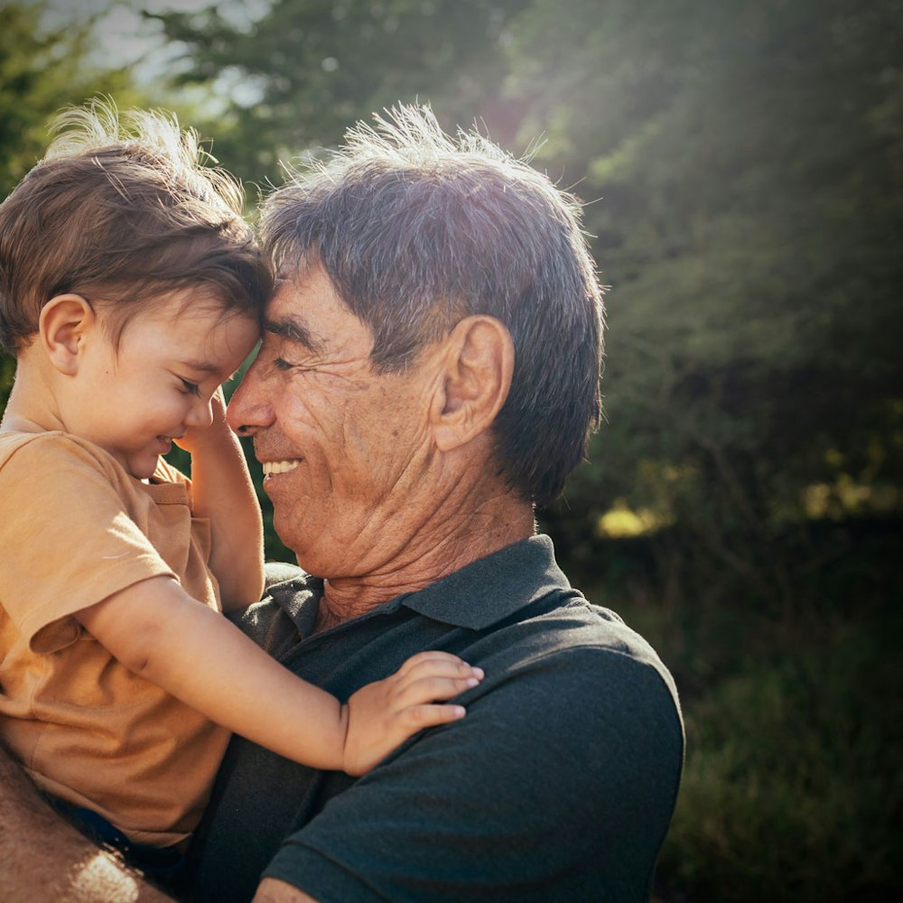 Grandfather hugging grandchild
