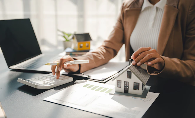 Person at a desk working on finances