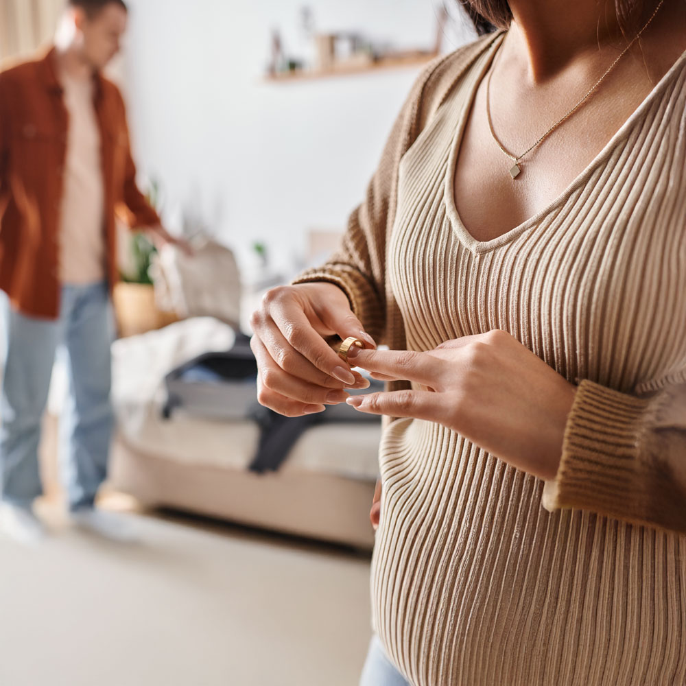Woman taking off wedding ring