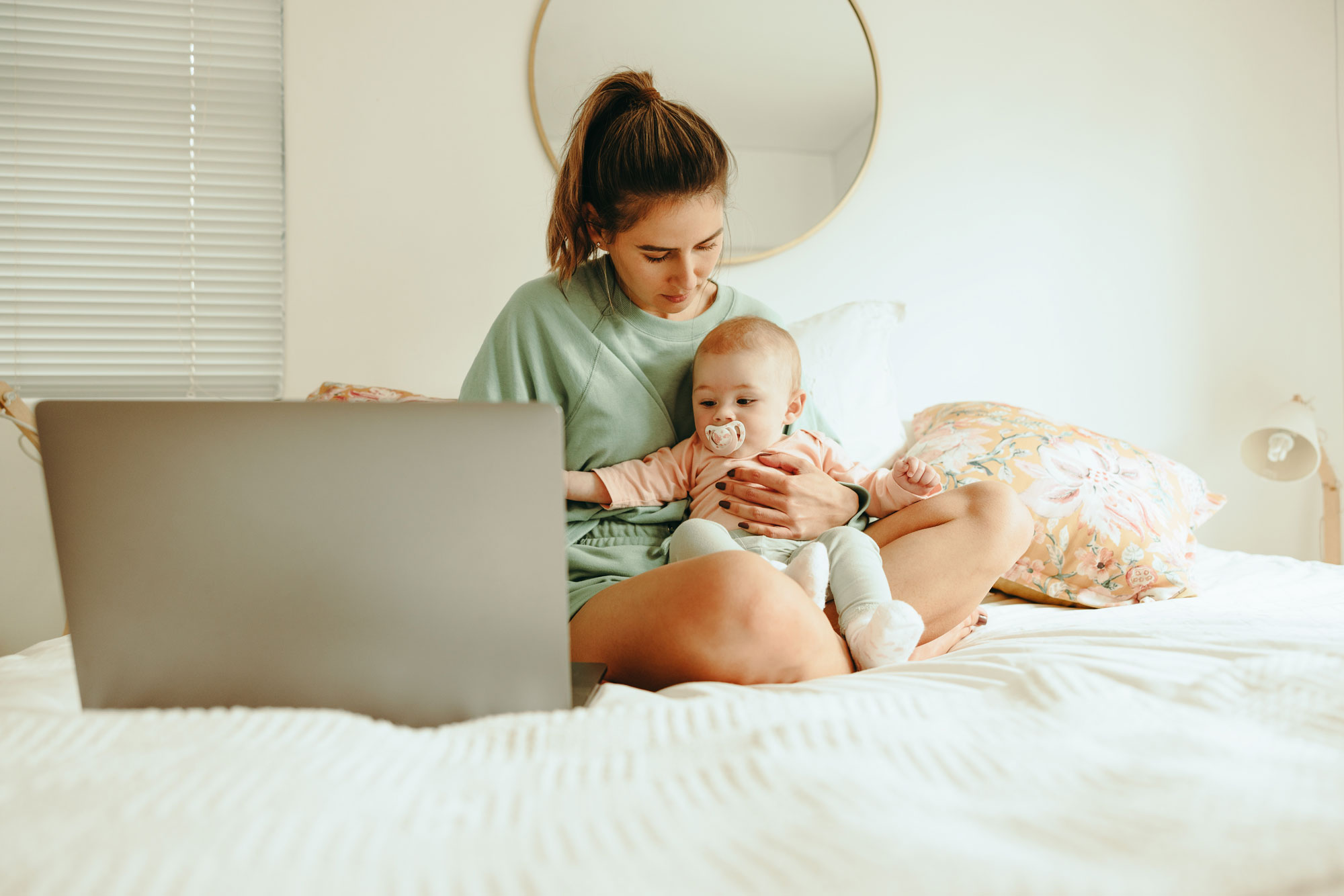 Mother and adopted baby on the bed