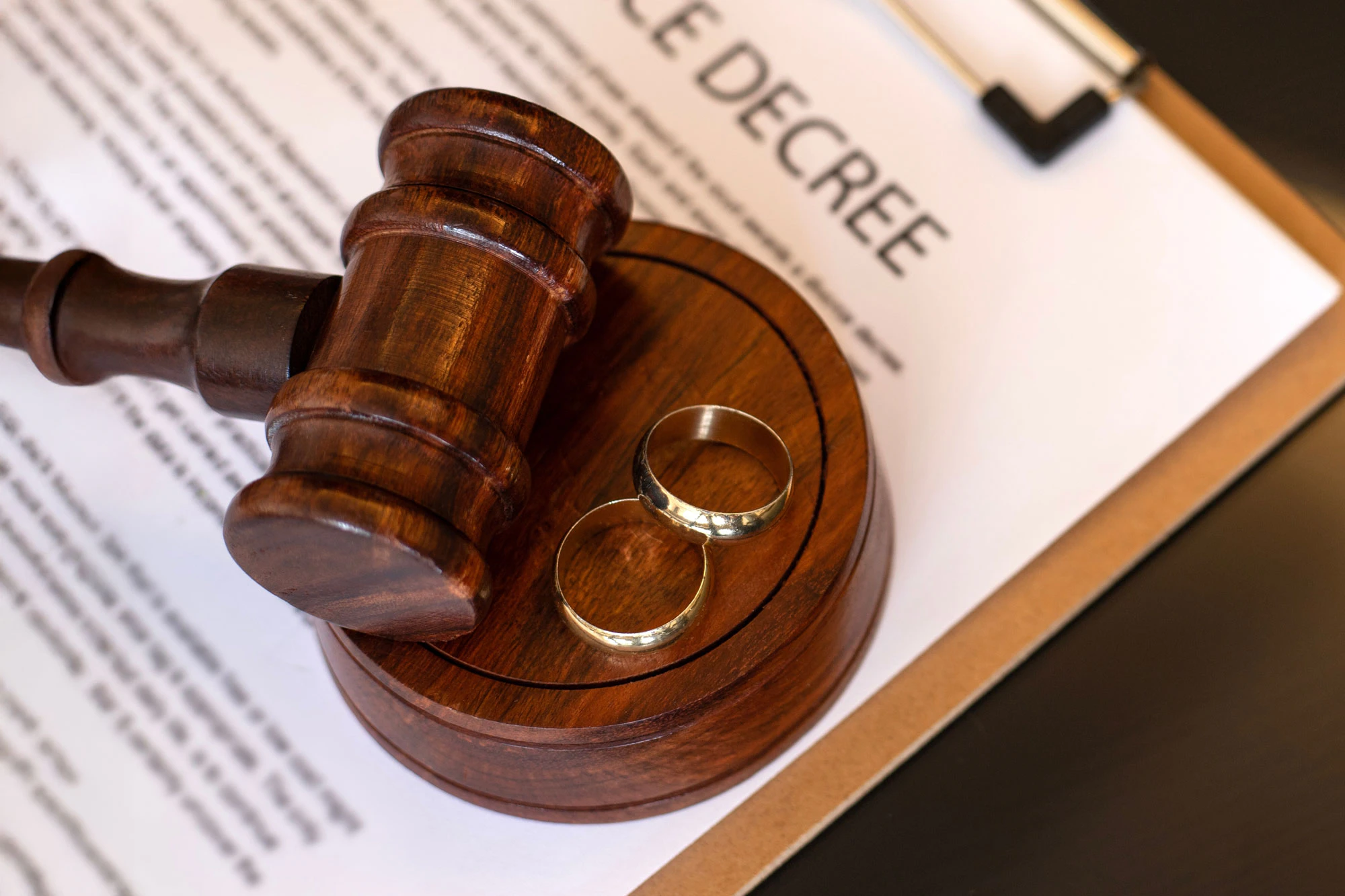 Gavel with wedding rings