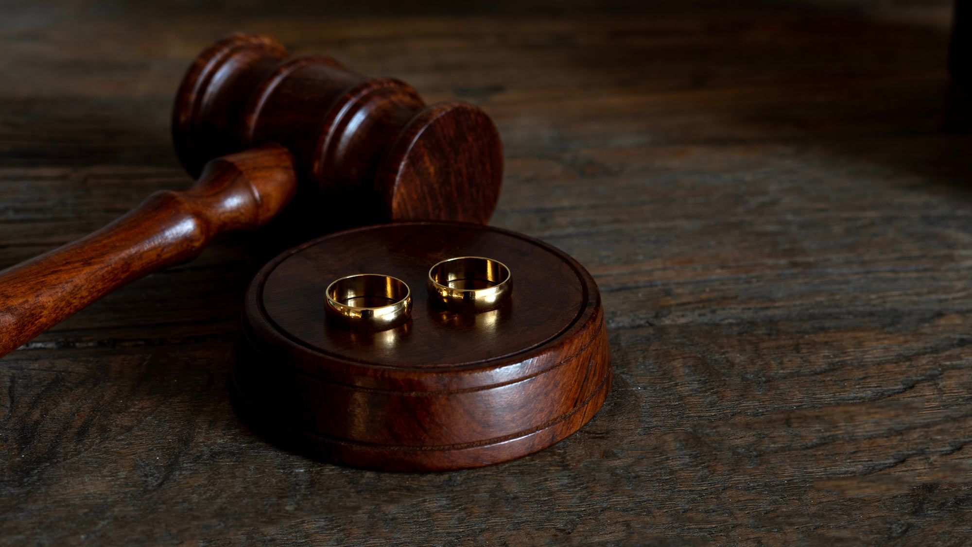 Gavel with wedding rings