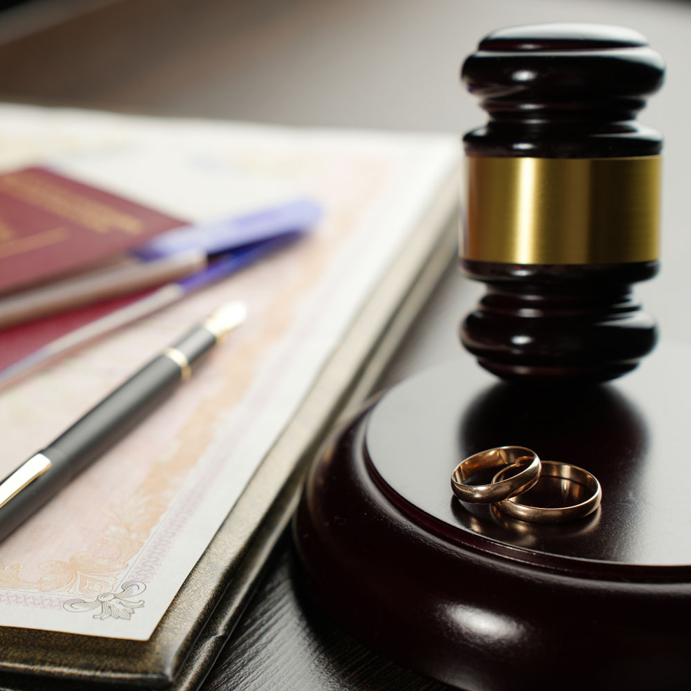 Gavel with wedding rings