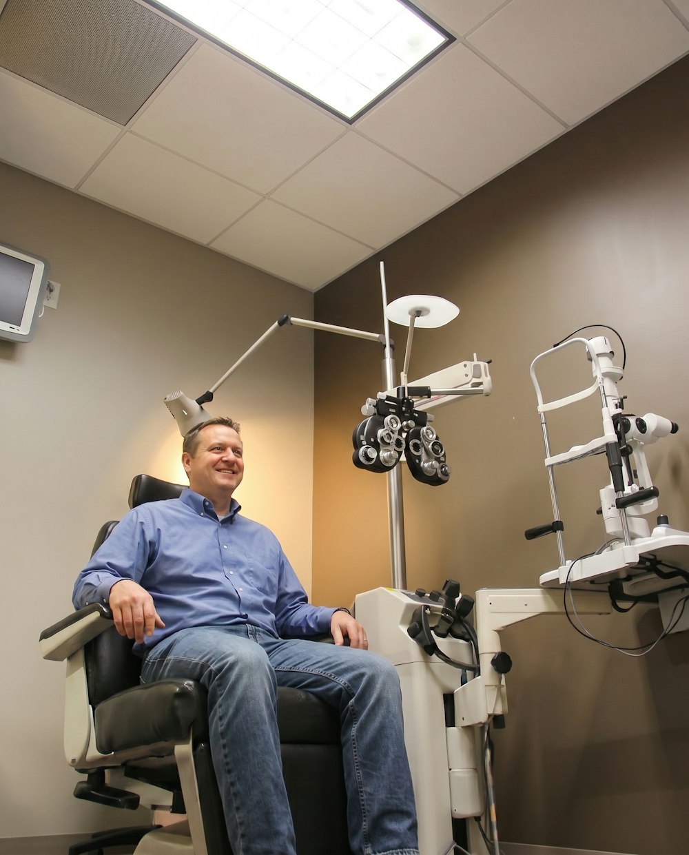 man in eye exam chair