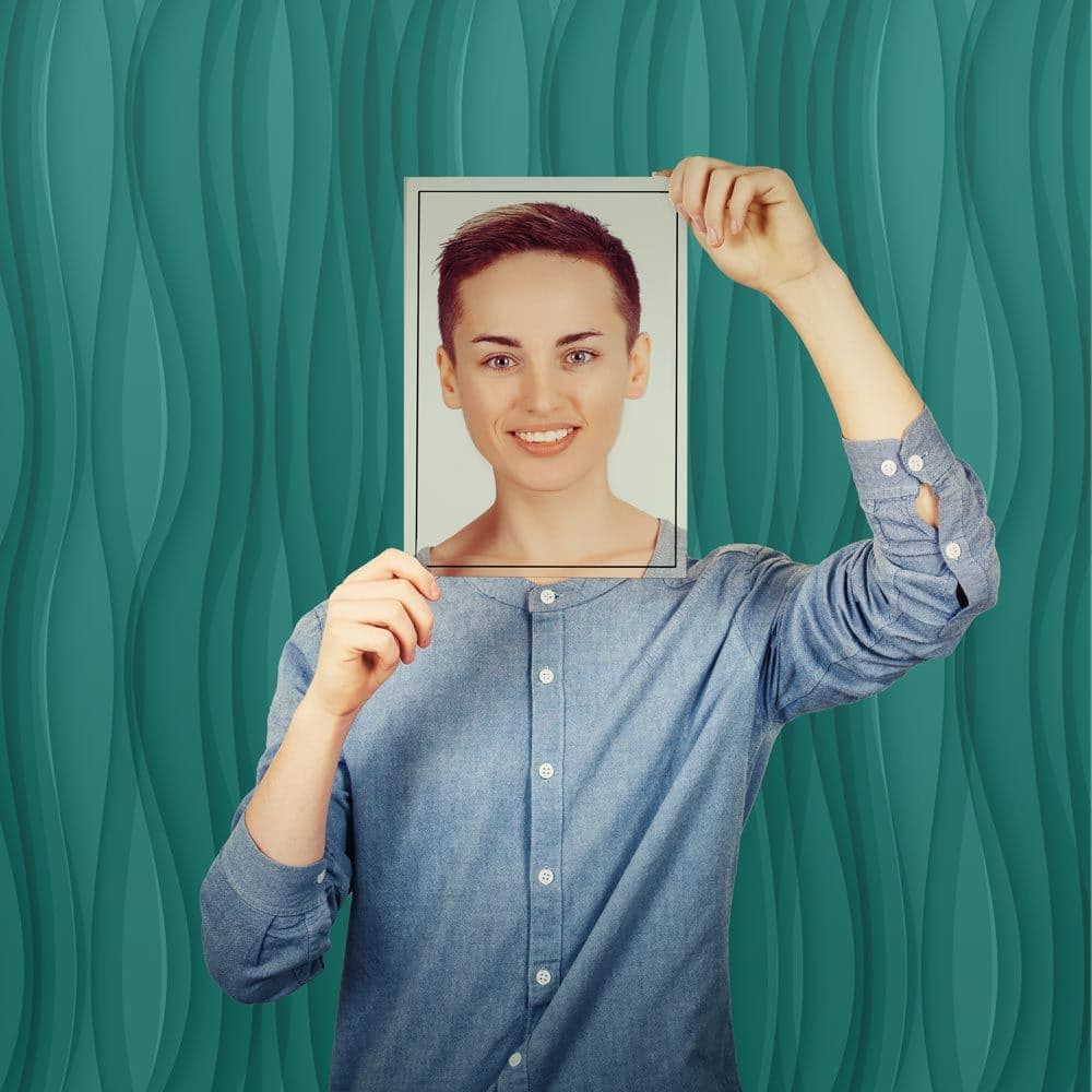 person hold photo over their face