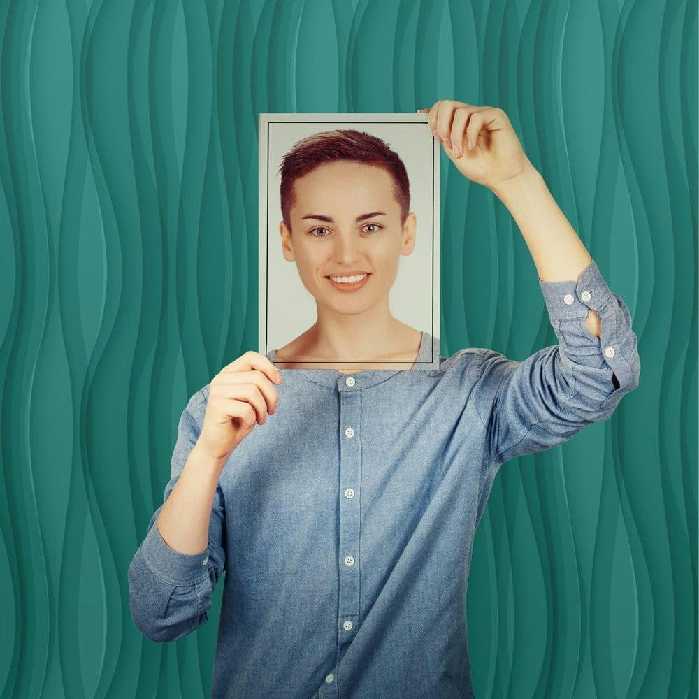 person hold photo over their face