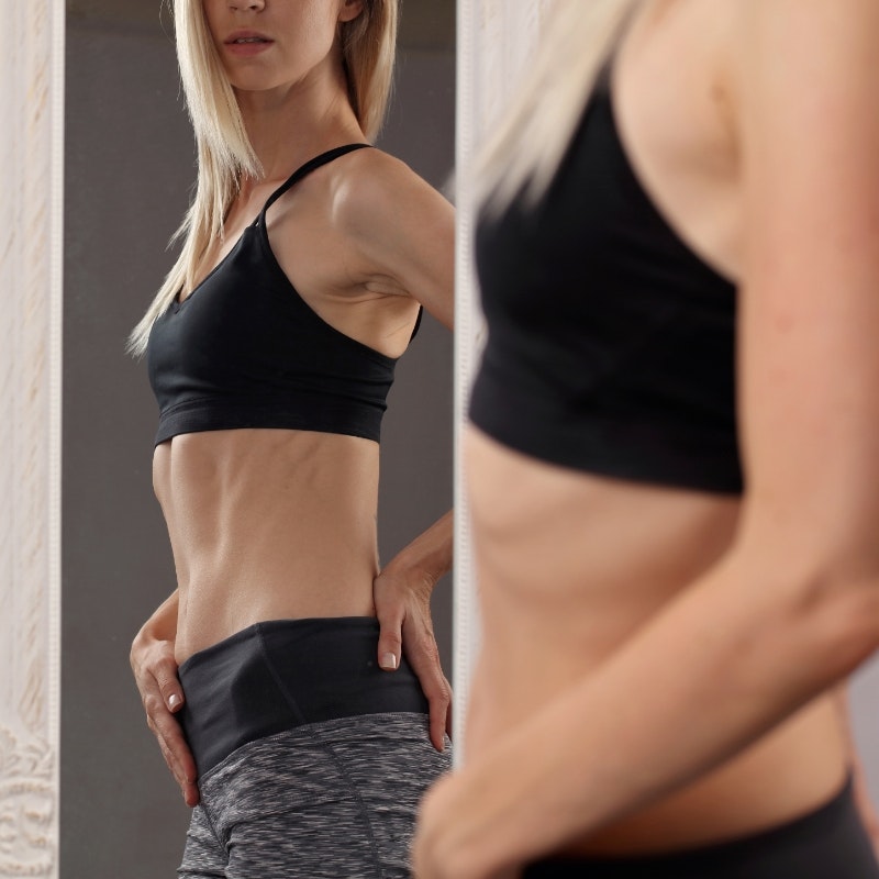 Woman looking in mirror