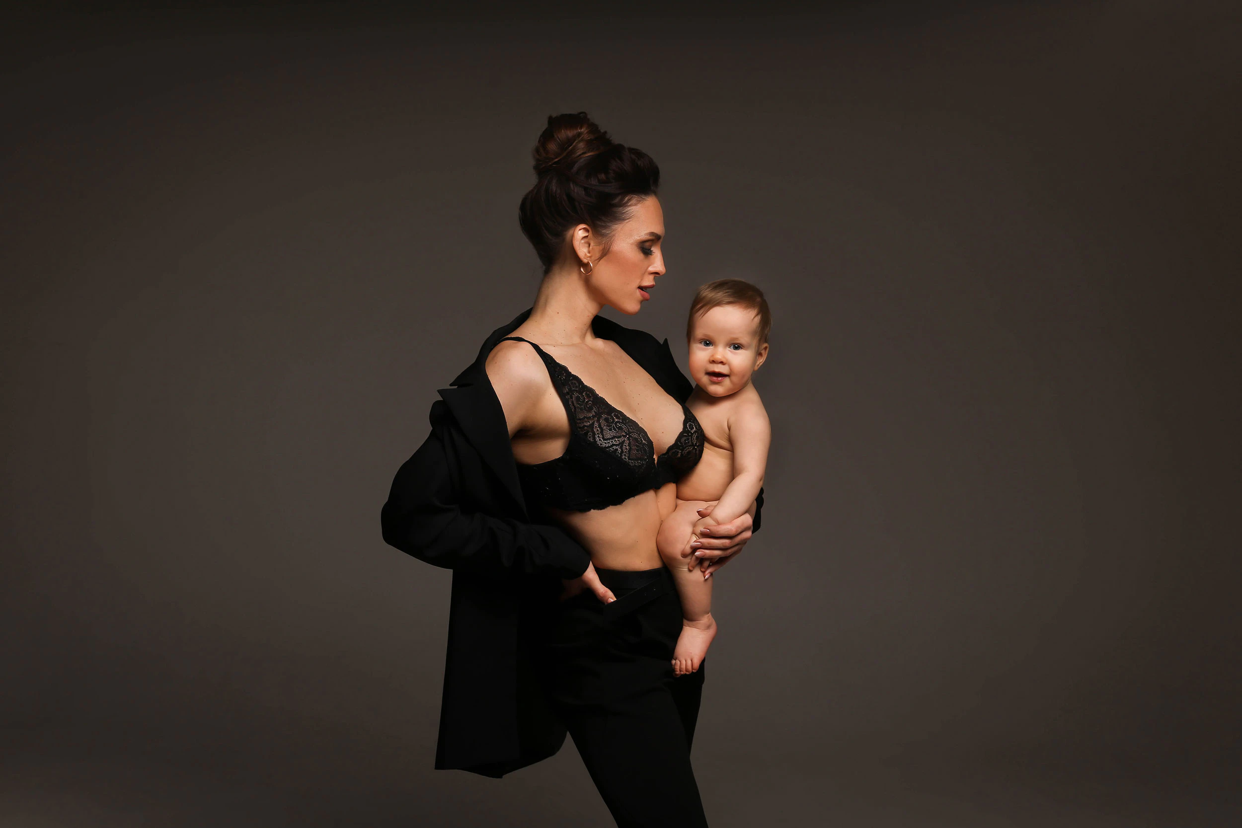 beautiful woman holding her baby