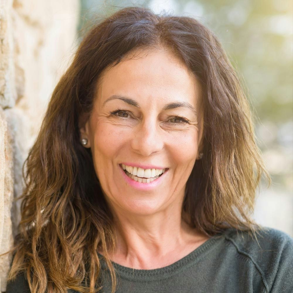 Older woman smiling outside