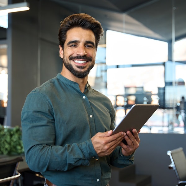Man smiling while working