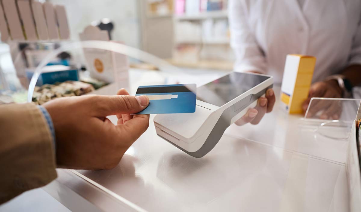 Patient using a credit card to pay at a front desk