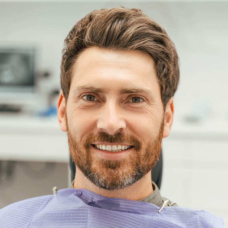 young brunette man smiling