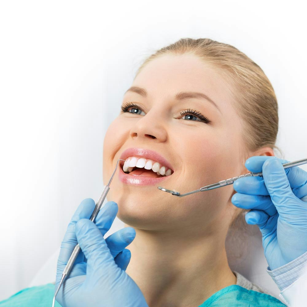 Smiling woman about to get her dental filling checked