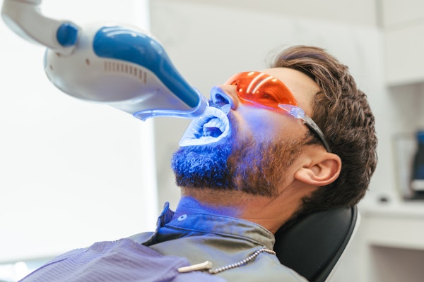 Man getting his teeth professionally whitened