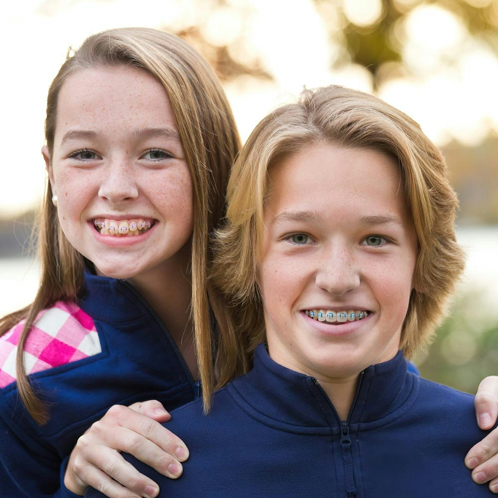 children smiling with braces