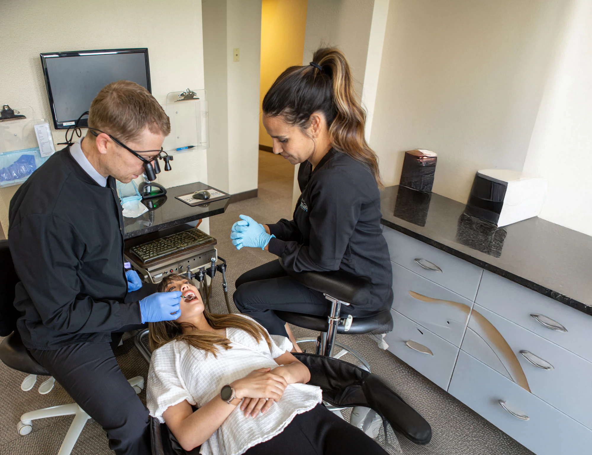 Dr. Maples and dental assistant working on a patient