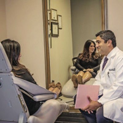 DR. RAVI TANDON AND A COLLEAGUE