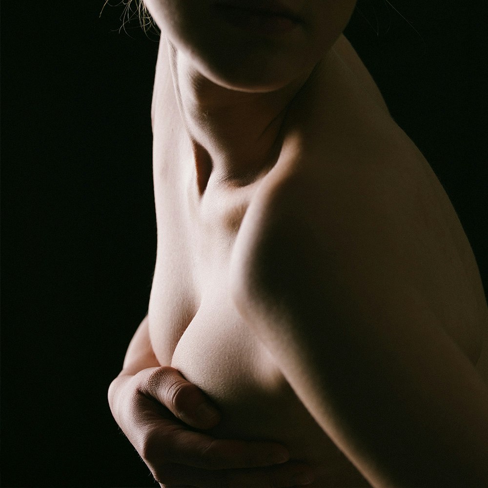 Woman holding her chest