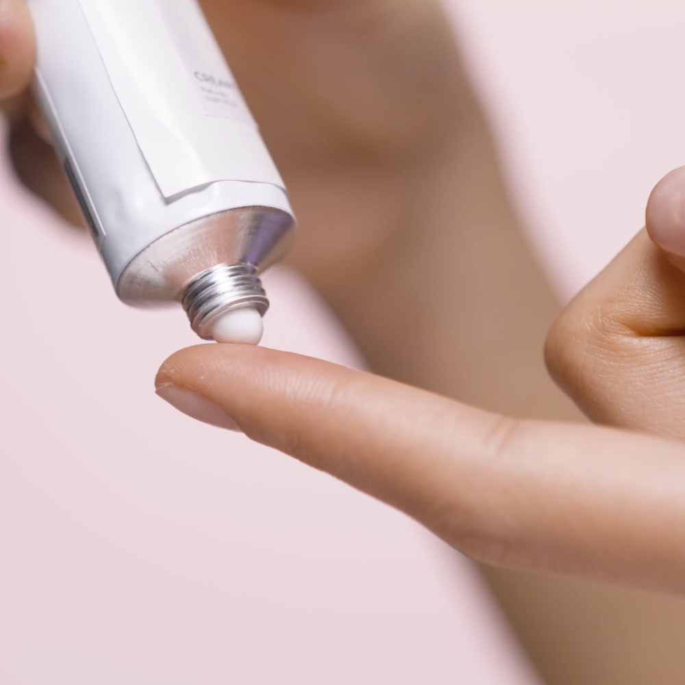 Ointment being applied to tip of finger