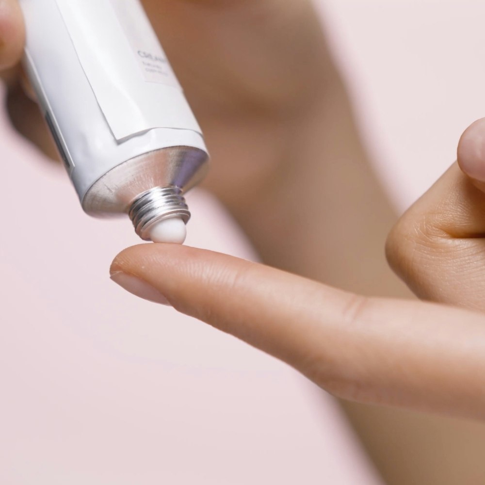 Ointment being applied to tip of finger
