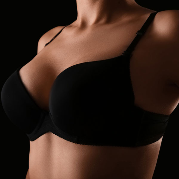 close up of breasts in black bra